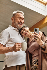 Joyful moments shared between a middle aged couple enjoying cozy time at home