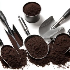 Variety Of Metal Scoops And Shovels Filled With Coffee Grounds On A Clean White Surface