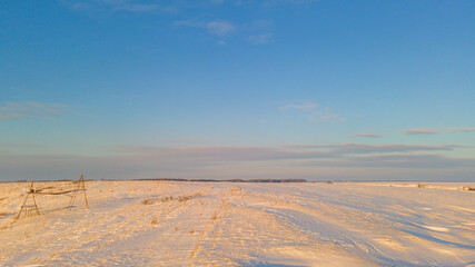 snow-covered winter fields in the cold in the sun