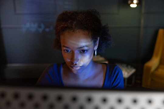 Intense Focus While Using a Computer at night