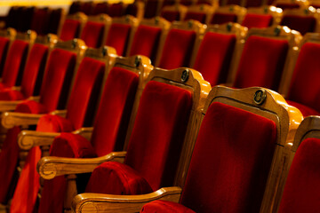Row of red seats in theatre