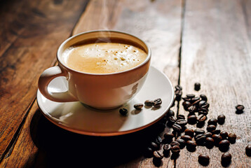 Coffee cup and coffee beans on wooden table, Espresso Crema coffee cup aromatic