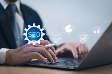 Concept of technology of search engine optimization SEO on internet web, businessman using computer to manage information search, customer base data connection, online marketing with virtual graphic