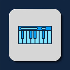 Filled outline Music synthesizer icon isolated on blue background. Electronic piano. Vector
