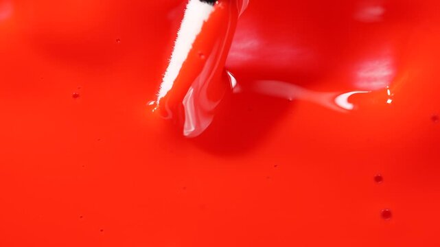 Classic red lipstick, lip gloss texture smear smudge swatch sample. Lipstick smear in trendy deep red color