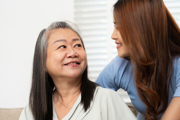 Wellness and Bonding. Mother and daughter sharing joyful moments at home.