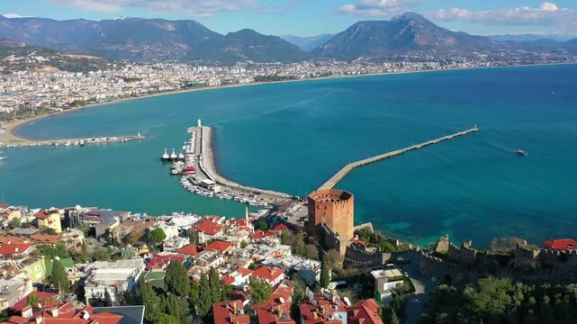 Aerial view of Red Tower (Kizil Kule), Alanya Marina and Mediterranean coast, T&uuml;rkiye. Taken with a drone.