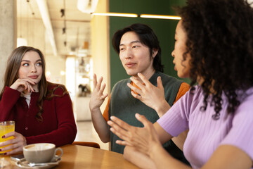 Engaged Discussion Among Diverse Colleagues at Cafe