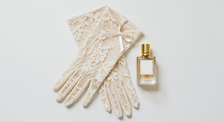 Elegant lace gloves paired with a perfume bottle on a light background