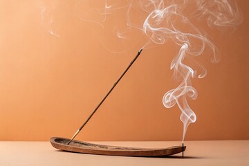 Burning Incense Stick with Smoke Trail Against a Pastel Orange Background