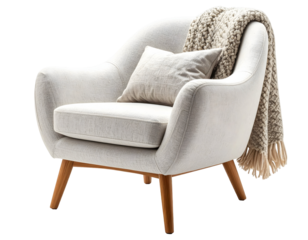 Light beige upholstered armchair with a knitted throw.