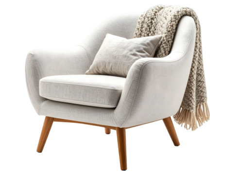 Light beige upholstered armchair with a knitted throw.
