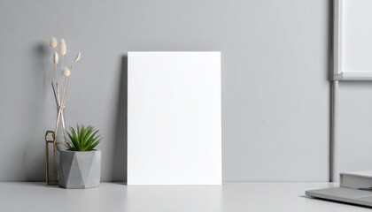 Elegant home office mockup featuring a blank card and potted succulent