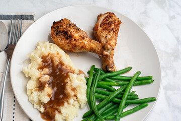 chicken drumsticks  with mashed potatoes