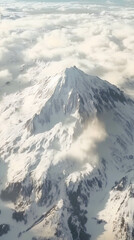 Stunning snow-capped mountain peak rises above clouds in a breathtaking landscape showcasing nature's beauty in winter
