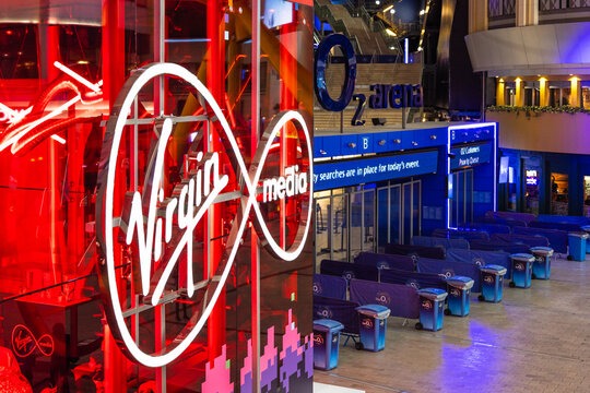 Virgin Media logo illuminated at the O2 Arena entrance. London, UK, 14 October 2023