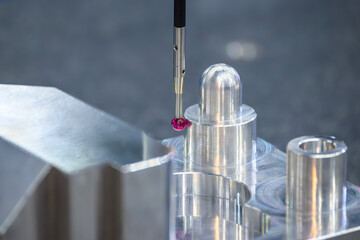 Close up scene the CMM machine measuring the aluminum machined  parts.