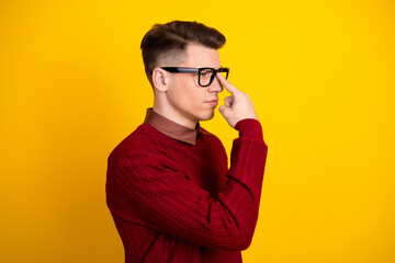 Young Handsome Handsome Man in Stylish Sweater Making Gesture Against Yellow Background