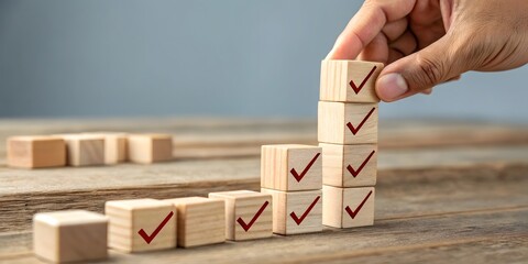 Checklist and task progress tracking concept. A hand placing the final checkmark on wooden blocks in a progress bar, task completion, productivity, goal setting, and efficient project management