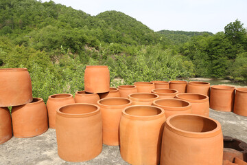 Obraz premium Traditional Georgian clay wine barrels for sale. Kakheti region symbol jug name is qvevri or kvevri