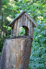 wooden feeder for forest animals in the park