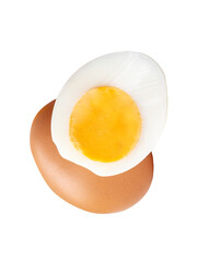 Front view of raw brown chicken egg and cooked or boiled chicken egg with egg yolk in half in small pile isolated with clipping path in png file format