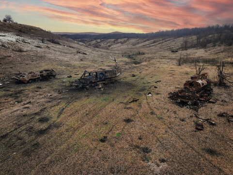 Aerial view of war-torn landscape in Ukraine with destroyed vehicles