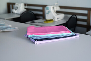 Fabrics and equipment in a busy sewing workshop