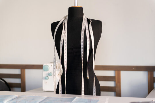 Tailor's workshop mannequin with measuring tape
