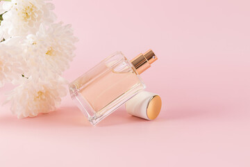Elegant perfume bottle with white flowers