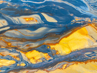 Aerial view of abstract nature textures in blue and yellow