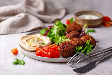 Salad with hummus, falafel and vegetables