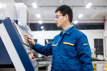 Asian engineers working in modern factory