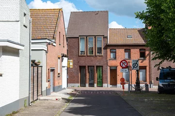 Tableau sur plexiglas Anvers Traditional brick stone houses in a row in the village center of Berendrecht, Antwerp, Belgium  © Werner