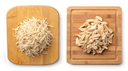 Shredded chicken on wooden cutting boards isolated against a white background top view preparation for meal