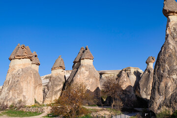 Fototapeta premium Fairy chimneys at Zelve and Pasabaglar Archaeological Site in Goreme, Cappadocia, Turkiye - Red tour 