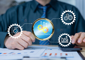 Productivity process concept, businessmen holding magnifying glass analysis output for efficient...