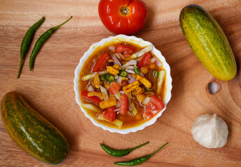 Ghugni is a famous street food of Eastern India. It is made with spices, chanachur, tomatoes, onions and green chilies. Selective focus and food photography with ingredient concept.