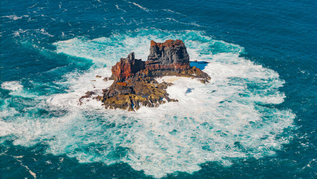Aerial view of roque de santo domingo with crashing waves and rugged rock formations, La Palma Island, Canary Islands, Spain.