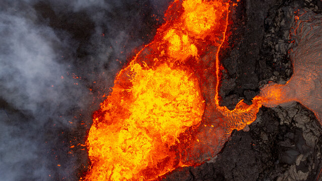 Aerial view of the majestic Volcano Litli-Hrutur with flowing lava and volcanic activity, Grindavik, Sudurnes, Iceland.