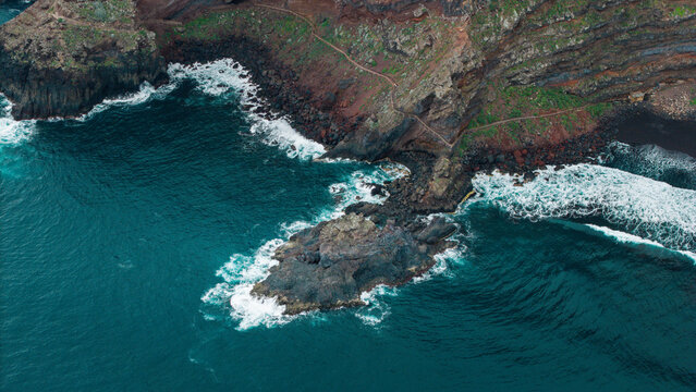 Aerial view of nogales beach with waves crashing against rugged cliffs, La Palma Island, Canary Islands, Spain.