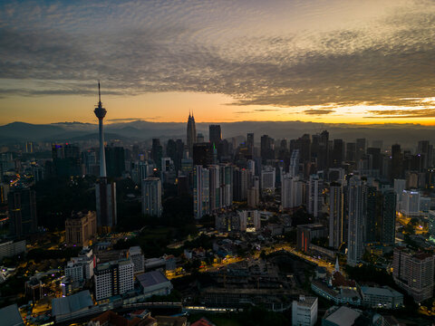 Aerial view of sunrise over the vibrant skyline featuring Merdeka 118 and city center, Kuala Lumpur, Malaysia.