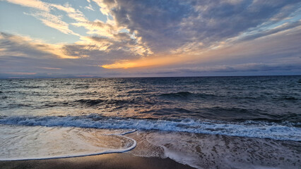 Beautiful colorful dramatic sky with clouds at sunset or sunrise.