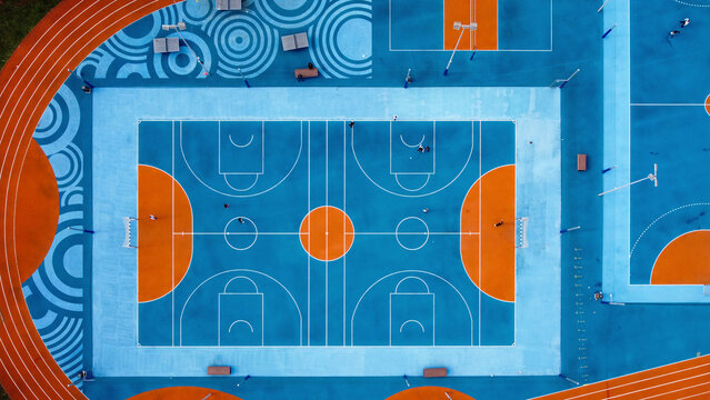 Aerial view of colorful sports court with geometric patterns and vibrant designs, Umag, Croatia.