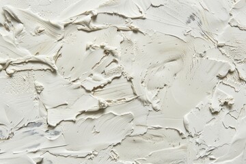 Here is a closeup view of a white wall that has a textured surface