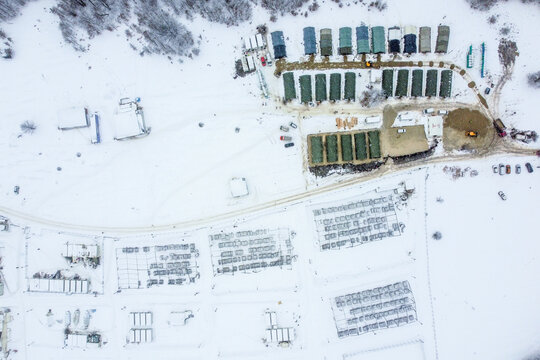 Aerial view of Lipa refugee camp with snowy landscape and temporary shelters, Bihac, Bosnia and Herzegovina.