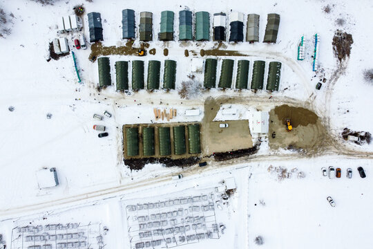 Aerial view of Lipa refugee camp with snowy tents in a winter landscape, Bihac, Bosnia and Herzegovina.