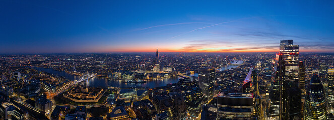 Aerial view of beautiful skyline with modern skyscrapers and the River Thames at sunset, London, England, United Kingdom.