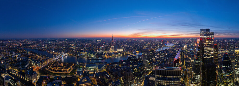 Aerial view of beautiful skyline with modern skyscrapers and the River Thames at sunset, London, England, United Kingdom.