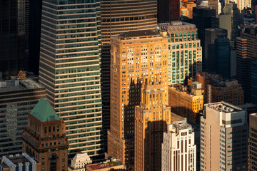 Aerial view of midtown manhattan skyscrapers in warm light of sunset, New York City, New York, United States.